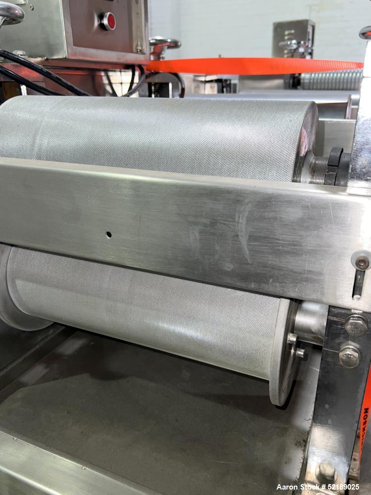 Used Shangha Target 11" Rolling & Scoring Line. Designed to make chiclets. Consisting of: Twin Screw extruder missing screws and die with motor drive, (3) sets of sheeting rollers measuring approxima...