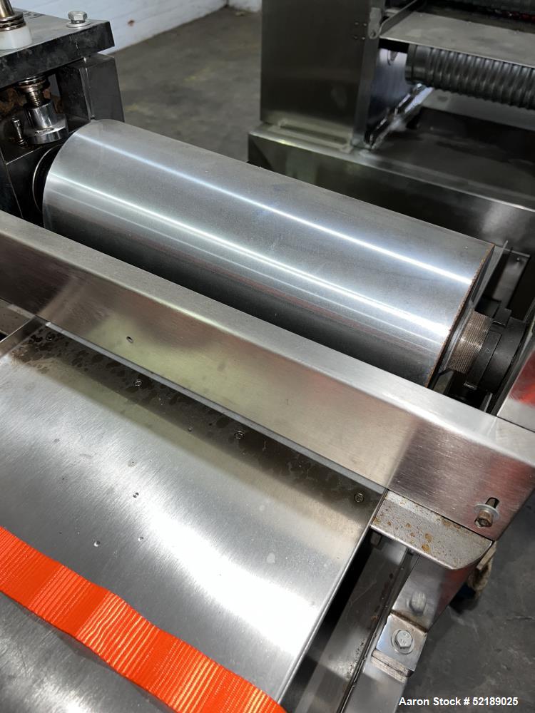Used Shangha Target 11" Rolling & Scoring Line. Designed to make chiclets. Consisting of: Twin Screw extruder missing screws and die with motor drive, (3) sets of sheeting rollers measuring approxima...