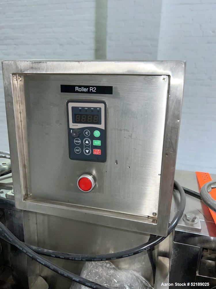Used Shangha Target 11" Rolling & Scoring Line. Designed to make chiclets. Consisting of: Twin Screw extruder missing screws and die with motor drive, (3) sets of sheeting rollers measuring approxima...