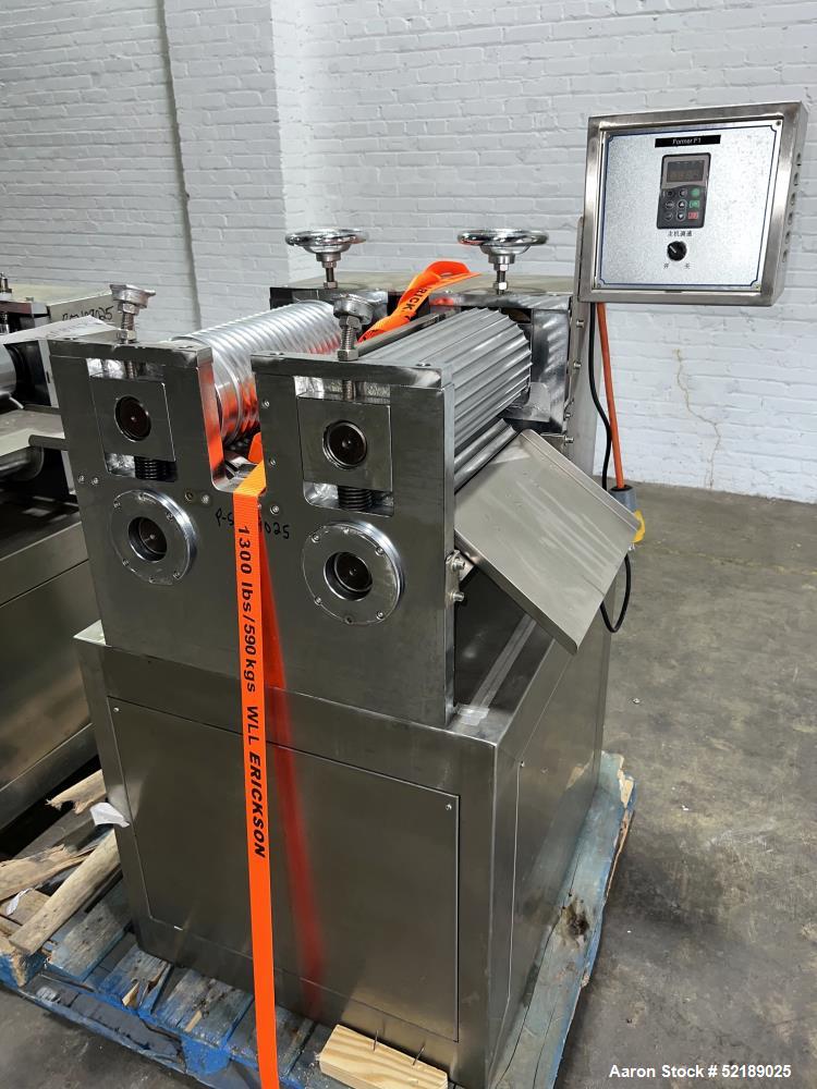Used Shangha Target 11" Rolling & Scoring Line. Designed to make chiclets. Consisting of: Twin Screw extruder missing screws and die with motor drive, (3) sets of sheeting rollers measuring approxima...