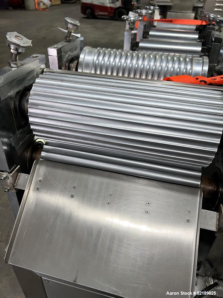 Used Shangha Target 11" Rolling & Scoring Line. Designed to make chiclets. Consisting of: Twin Screw extruder missing screws and die with motor drive, (3) sets of sheeting rollers measuring approxima...