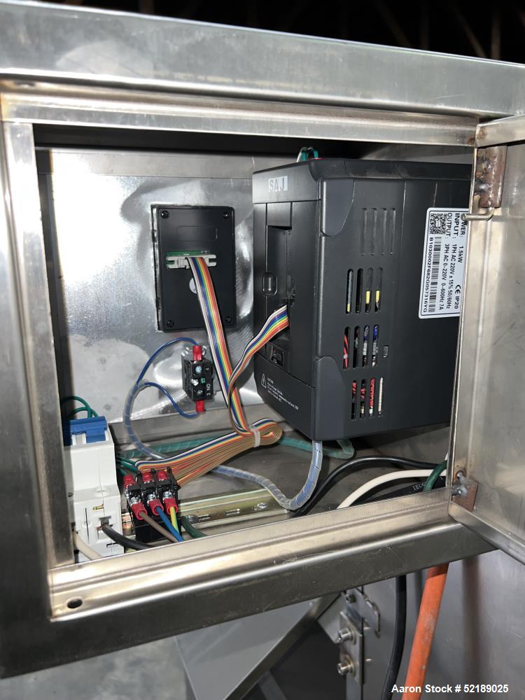 Used Shangha Target 11" Rolling & Scoring Line. Designed to make chiclets. Consisting of: Twin Screw extruder missing screws and die with motor drive, (3) sets of sheeting rollers measuring approxima...