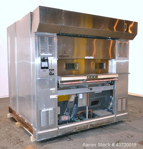 Used Baxter Revolving Tray Oven, Model OV850G-12A.  Natural gas fired, 150,000 BTU.  (4) Approximately 58" wide x 26" deep carbon steel trays, manual front door with (2) windows, approximate 12" open...