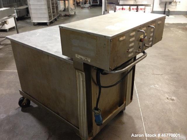 Used Belshaw 400 Donut Line. Including: infeed, double proof-box, fryer, fryer hood, 180 degree belt, small in- feed belt, Waterfall glazer, cooling belt, shortening filter and cake depositor, includ...