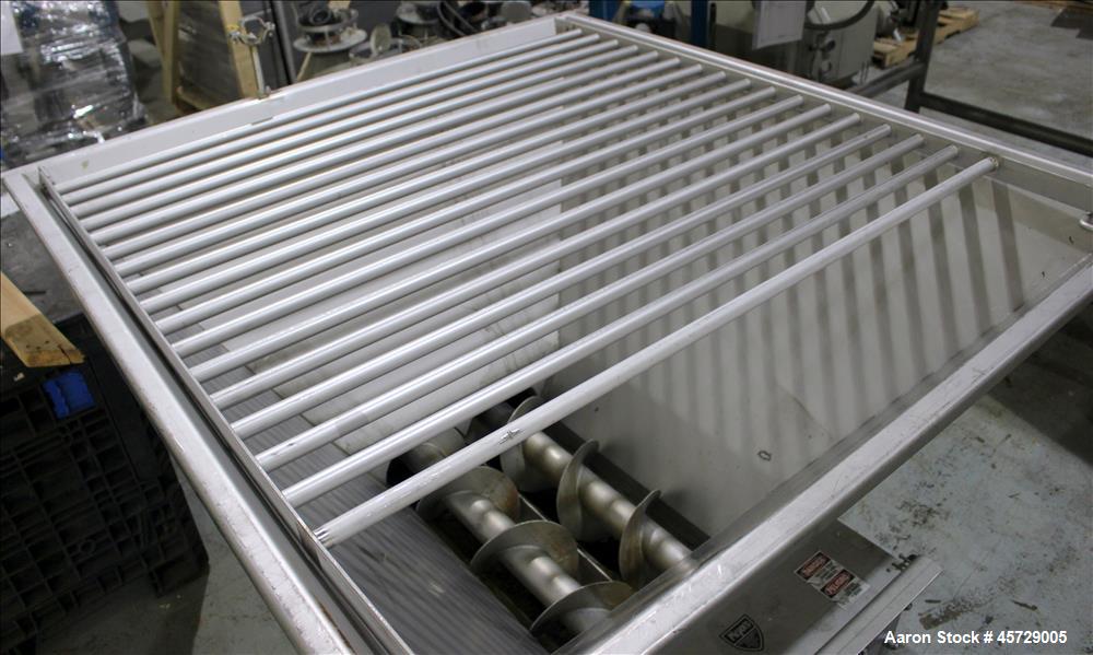 Used Mepaco Dual Auger Feeder, Model 105, 3,000 pound capacity, 304 Stainless Steel. Hopper is 60" long x 64" wide x 36" deep. Includes (2) 8" diameter x 48" long augers, driven by a 7.6kw, 3/60/230/...