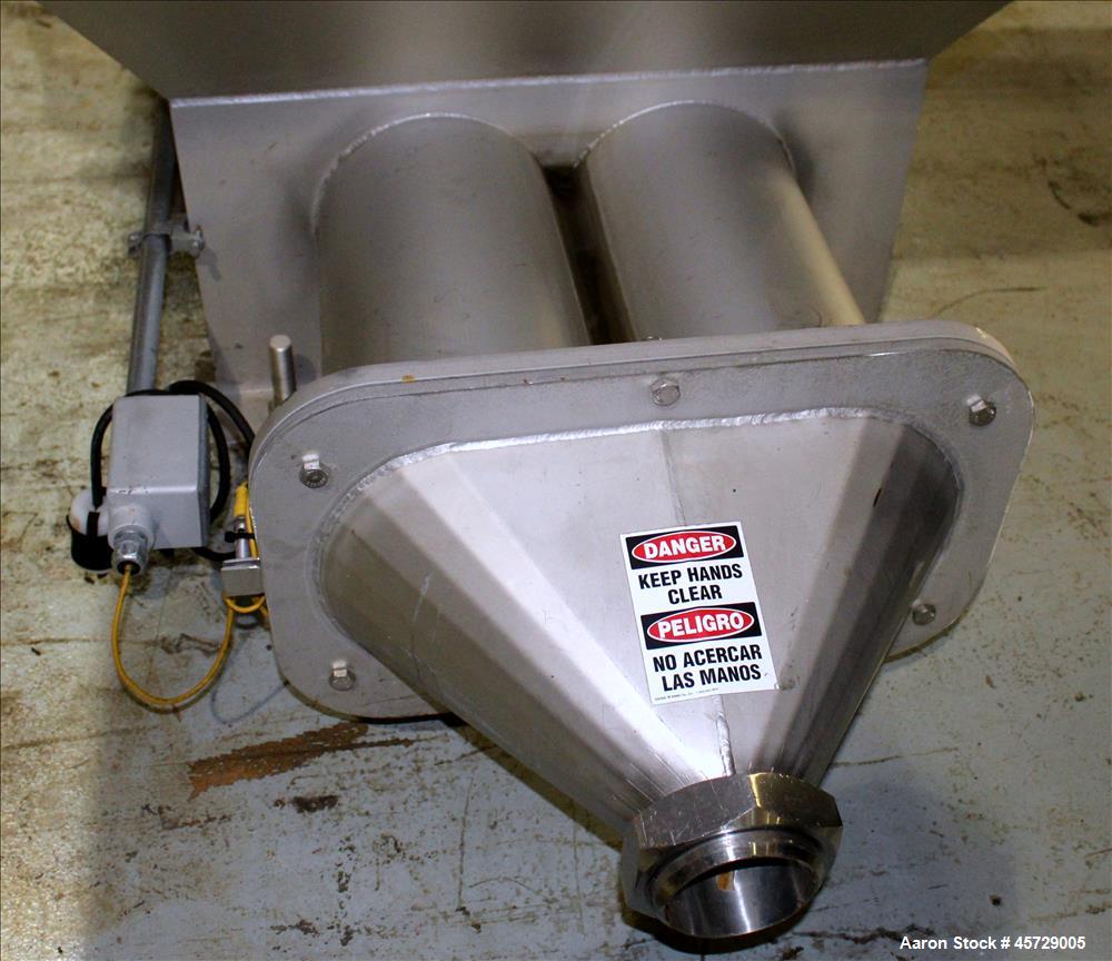 Used Mepaco Dual Auger Feeder, Model 105, 3,000 pound capacity, 304 Stainless Steel. Hopper is 60" long x 64" wide x 36" deep. Includes (2) 8" diameter x 48" long augers, driven by a 7.6kw, 3/60/230/...