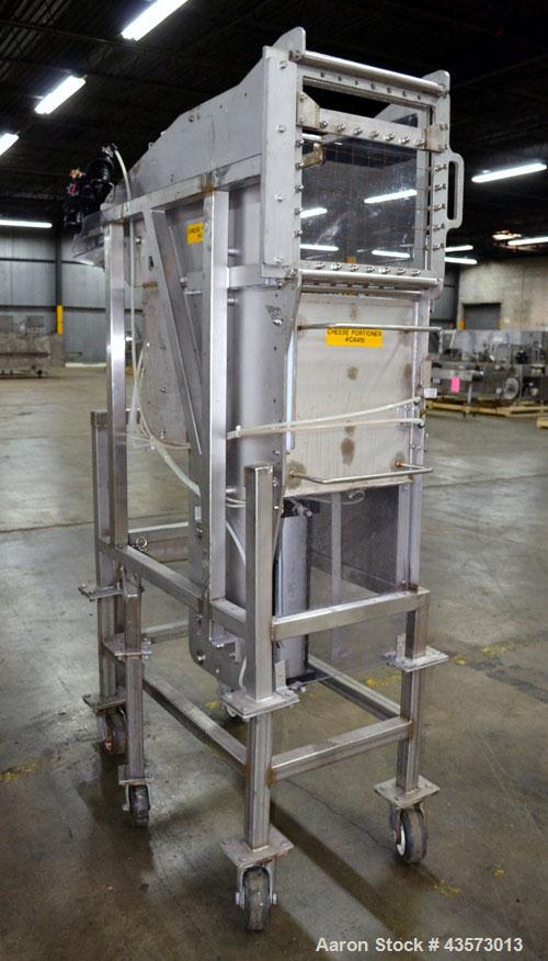 Used Cheese Block Cutter/Portioner. Machine is of stainless steel construction. Designed to cut blocks approximately (length) 17-1/2" x (Width) 14-1/4" x 24". Is an upcut into a cross cut direction m...