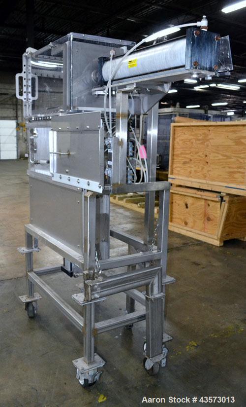 Used Cheese Block Cutter/Portioner. Machine is of stainless steel construction. Designed to cut blocks approximately (length) 17-1/2" x (Width) 14-1/4" x 24". Is an upcut into a cross cut direction m...
