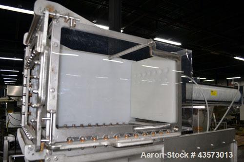 Used Cheese Block Cutter/Portioner. Machine is of stainless steel construction. Designed to cut blocks approximately (length) 17-1/2" x (Width) 14-1/4" x 24". Is an upcut into a cross cut direction m...