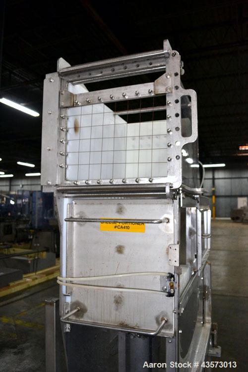 Used Cheese Block Cutter/Portioner. Machine is of stainless steel construction. Designed to cut blocks approximately (length) 17-1/2" x (Width) 14-1/4" x 24". Is an upcut into a cross cut direction m...
