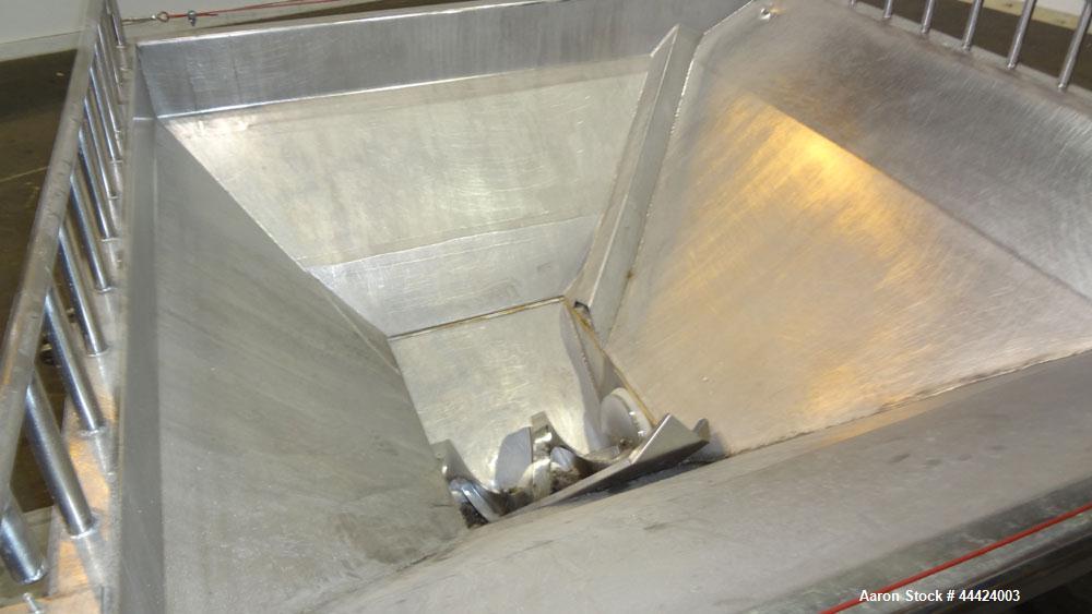 Used Peerless Spiral Flow Dough Feeder, Model SF-20CT, 304 Stainless Steel. 2000 Pound hopper capacity, approximately 66” long x 66” wide. Includes an approximately 8” diameter spiral auger, driven b...