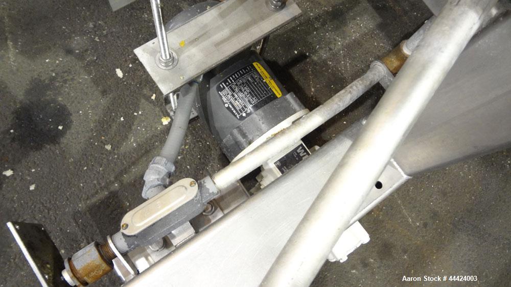 Used Peerless Spiral Flow Dough Feeder, Model SF-20CT, 304 Stainless Steel. 2000 Pound hopper capacity, approximately 66” long x 66” wide. Includes an approximately 8” diameter spiral auger, driven b...