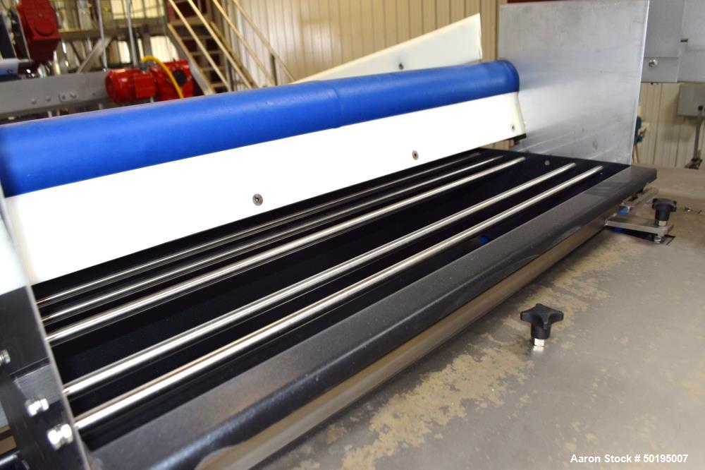Used Rademaker Sheeting System For Chips, 1000mm Wide, Serial# 7193, Built 2008. Consisting of: (1) 10" wide x 96" long rubber belt conveyor with a 0.37kw gear motor, (1) 3 roll inclined belt feeder ...