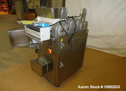Used Rheon Cornucopia Extruder Encruster, Model KN400, Stainless Steel. Rated 60 PPM. Belt speed .07 - 1.20 feet per second (1.3-22 meters per second), .02 - .66 LB (10-300 gram) weight range, with a...
