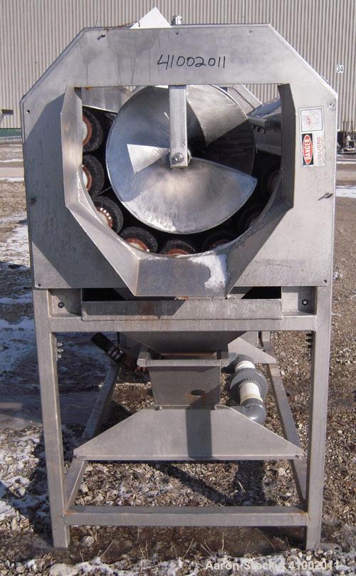 Used Vanmark Equipment Peeler/Washer, 304 Stainless Steel. (8) approximately 5" diameter x 69" long nylon brush rollers, (1) screw feed and discharge section, all driven by a 7.5 HP, 3/60/208-230/460...