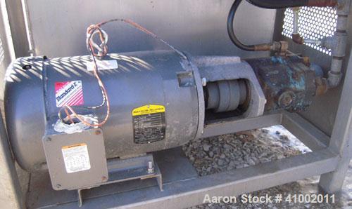 Used Vanmark Equipment Peeler/Washer, 304 Stainless Steel. (8) approximately 5" diameter x 69" long nylon brush rollers, (1) screw feed and discharge section, all driven by a 7.5 HP, 3/60/208-230/460...