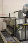 Used Orel Bakery Equipment Pita Bread Oven, Model P Tunnel Oven. In Feed, Transfer Conveyor gas Flat Bread/Pita Oven. Continuous Feed. Dimensions: 30' x 9' x 9'. Control Panel: 30