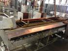 Used Belshaw 400 Donut Line. Including: infeed, double proof-box, fryer, fryer hood, 180 degree belt, small in- feed belt, Waterfall glazer, cooling belt, shortening filter and cake depositor, includ...