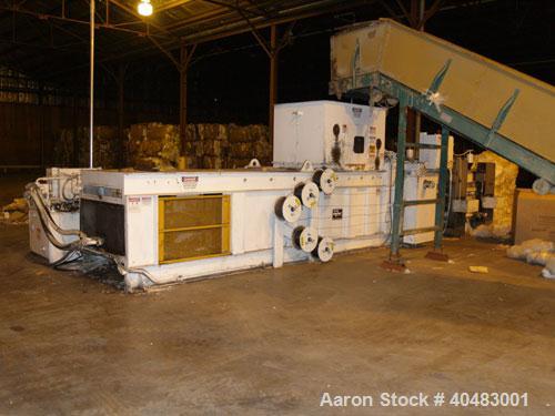 Used-Marathon auto tie baler, model AT-604242850A, driven by a 60 hp motor.