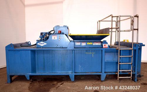 Used Excel Manufacturing Horizontal Baler, Model EX60II, Carbon Steel. Approximate bale size 30" x 55". Top feed with chute. Approximate 20hp motor.