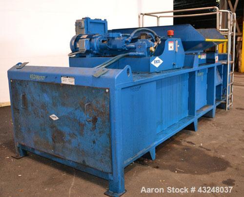 Used Excel Manufacturing Horizontal Baler, Model EX60II, Carbon Steel. Approximate bale size 30" x 55". Top feed with chute. Approximate 20hp motor.