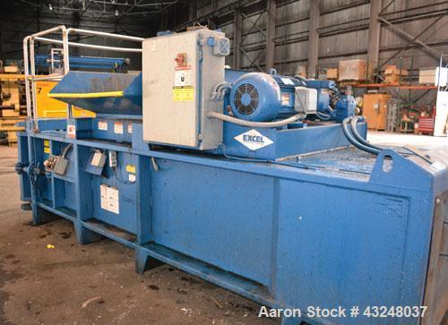 Used Excel Manufacturing Horizontal Baler, Model EX60II, Carbon Steel. Approximate bale size 30" x 55". Top feed with chute. Approximate 20hp motor.
