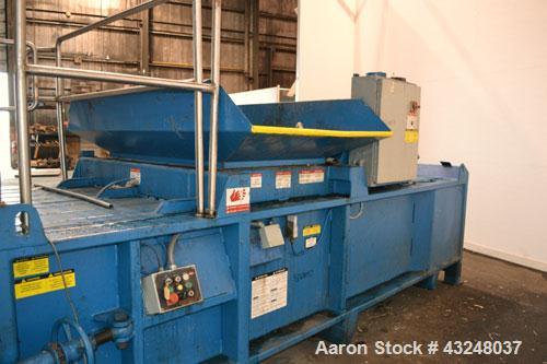 Used Excel Manufacturing Horizontal Baler, Model EX60II, Carbon Steel. Approximate bale size 30" x 55". Top feed with chute. Approximate 20hp motor.