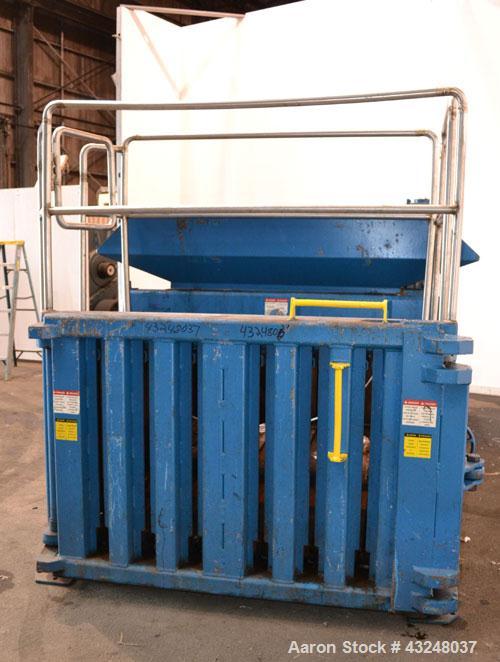 Used Excel Manufacturing Horizontal Baler, Model EX60II, Carbon Steel. Approximate bale size 30" x 55". Top feed with chute. Approximate 20hp motor.