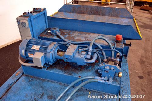 Used Excel Manufacturing Horizontal Baler, Model EX60II, Carbon Steel. Approximate bale size 30" x 55". Top feed with chute. Approximate 20hp motor.