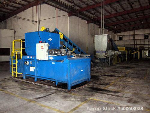 Used Excel Manufacturing Horizontal Baler, Model EX62, Carbon Steel. Approximate bale size 30" x 55". Top feed with chute. Approximate 20hp motor. Includes an approximate 16" wide x 20' long inclined...