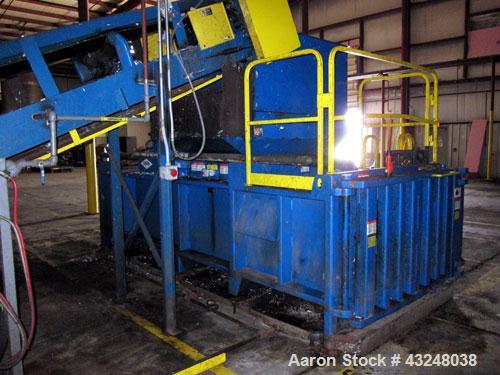 Used Excel Manufacturing Horizontal Baler, Model EX62, Carbon Steel. Approximate bale size 30" x 55". Top feed with chute. Approximate 20hp motor. Includes an approximate 16" wide x 20' long inclined...