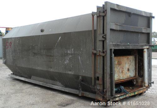 Used Octagonal Dock Feed Trash Compactor, approximately 40 yard receiving container, carbon steel. Side swing closure door. Single ram with an approximate 10 hp power pack. Dock feed platform with re...