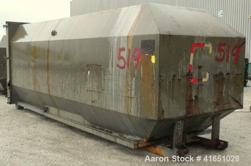 Used Octagonal Dock Feed Trash Compactor, approximately 40 yard receiving container, carbon steel. Side swing closure door. Single ram with an approximate 10 hp power pack. Dock feed platform with re...