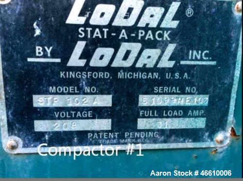 Used LoDal Stat-A-Pack Trash Compactor. 8 yard, has guide island, 208 volt.