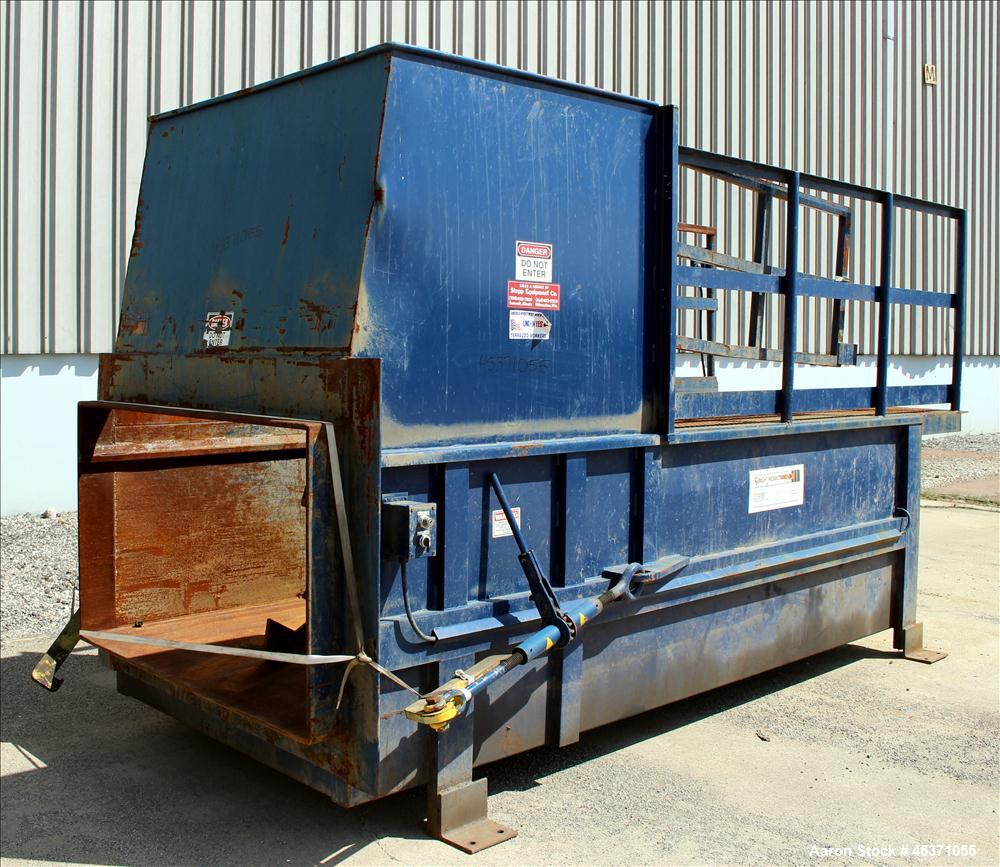 Used- Sebright Products Model 5060 Trash Compactor.