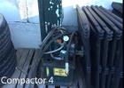 Used Parker Trash Compactor. Capacity: 15 yards, measurements: 15 ft. x 8 ft. x 8 ft. Voltage: 220.
