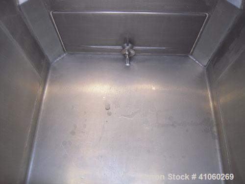 Used Custom Metal Craft Powder Stackable Tote Bin, Approximately 50 Cubic Feet, Aluminum. 48" Wide x 42" long x approximately 43" deep. 22" Diameter top opening with cover, 33" x 14" hinged side bott...