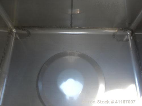 Used IBC Precision Stackable Liquid Tote, 46.7 cubic feet ( 350 gallon), model SS350, 304 stainless steel. 48’’ long x 42’’ wide x 36’’ deep. 22’’ diameter top opening with cover, off center bottom o...