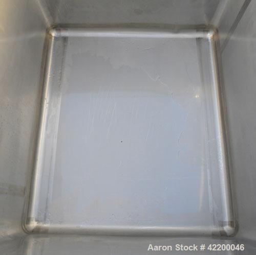 Used Custom Powder Systems Open Top Rolled Lip Bin, 49.4 cubic feet, 304L stainless steel. 42’’ wide x 48’’ long x 48’’ deep. Mounted on stainless steel legs.