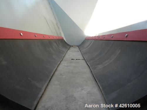 Used Front End Loading Hopper/Feeder, approximate 10 ton storage capacity, approximate 150 cubic feet, carbon steel. Coned top hopper 160'' long x 62'' wide x 56'' deep. Bottom discharge rubber belt,...