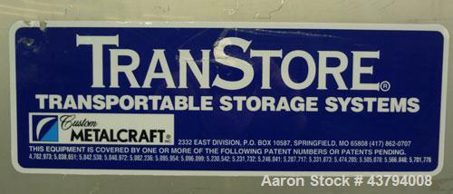 Used Custom Metalcraft TransStore Transportable Powder Tote, Approximate 60 Cubic Feet (448 gallon), Model 512697, 316L Stainless Steel. 48" Long x 42 wide x 44" straight side x coned bottom, flat to...