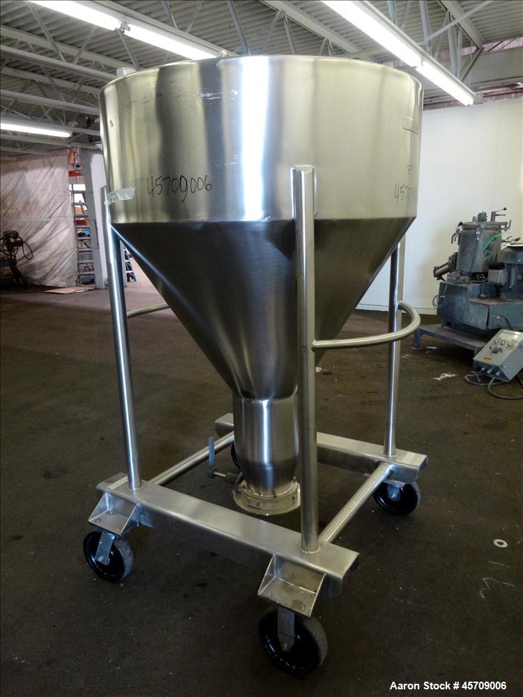 Used United Utensils Powder Tote Bin, Approximate 20 Cubic Feet, 304 Stainless Steel. Approximately 48" diameter x 17" straight side and 34" coned bottom. Flat top includes 20" opening with a plastic...
