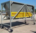 Used Front End Loading Hopper/Feeder, approximate 10 ton storage capacity, approximate 150 cubic feet, carbon steel. Coned top hopper 160'' long x 62'' wide x 56'' deep. Bottom discharge rubber belt,...