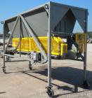 Used Front End Loading Hopper/Feeder, approximate 10 ton storage capacity, approximate 150 cubic feet, carbon steel. Coned top hopper 160'' long x 62'' wide x 56'' deep. Bottom discharge rubber belt,...