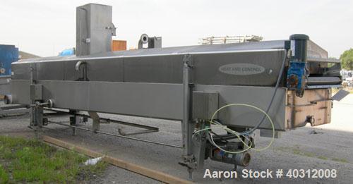 Used Heat and Control Heat Wave Fryer, Model HWF. 28" wide x 12' long, 304 stainless steel wire mesh belt, driven by a 1 hp, 3/60/208-230/460 volt, 1725 rpm gearmotor. Approximate fry time 7-28 secon...