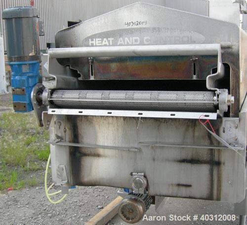 Used Heat and Control Heat Wave Fryer, Model HWF. 28" wide x 12' long, 304 stainless steel wire mesh belt, driven by a 1 hp, 3/60/208-230/460 volt, 1725 rpm gearmotor. Approximate fry time 7-28 secon...