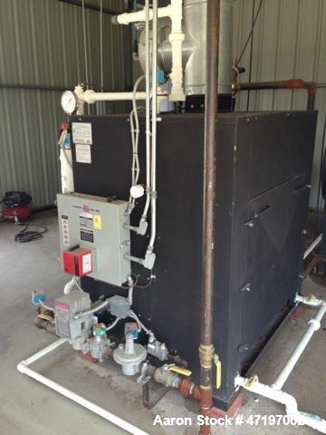 Used Parker Boiler, Model 104-30. 30hp at 125 PSI, natural gas fired, 1.26mm btu / hr. Includes boiler feed water softener and tank. Water softener tank and boiler feed water return system.