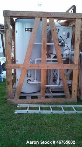 Unused- Lochinvar Copper-Fin Commercial Gas Water Heater, Model CWN0495PM. Includes (2) 495,000 BTU boilers, (1) 257 gallon storage tank, (2) Armstrong pumps. Mounted on factory mounting system.