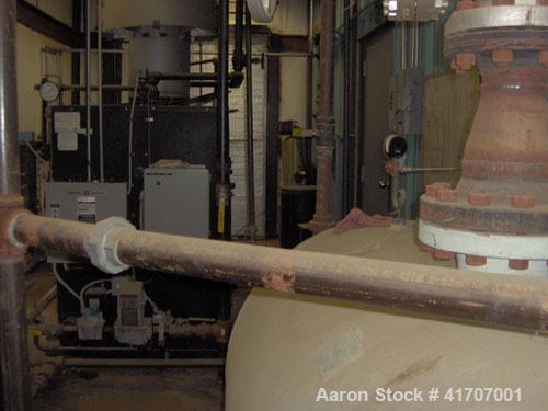 Used Parker Water Tube Boiler, Model 104-50. Natural gas, 50 hp, 1725 pounds/hour, 200 psi. Includes blowdown tank, pressure tank and all related equipment. Mfg 2000. Less than 1000 hours.