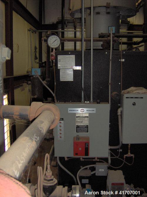 Used Parker Water Tube Boiler, Model 104-50. Natural gas, 50 hp, 1725 pounds/hour, 200 psi. Includes blowdown tank, pressure tank and all related equipment. Mfg 2000. Less than 1000 hours.